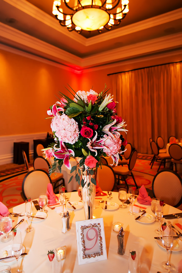 Wedding Reception Table Decor with Tall, Pink and Green Floral Centerpieces and Coral Uplighting | Beach Wedding Ceremony, Bride and Dad Walking Down Aisle |Clearwater Beach Wedding Florist Iza's Flowers