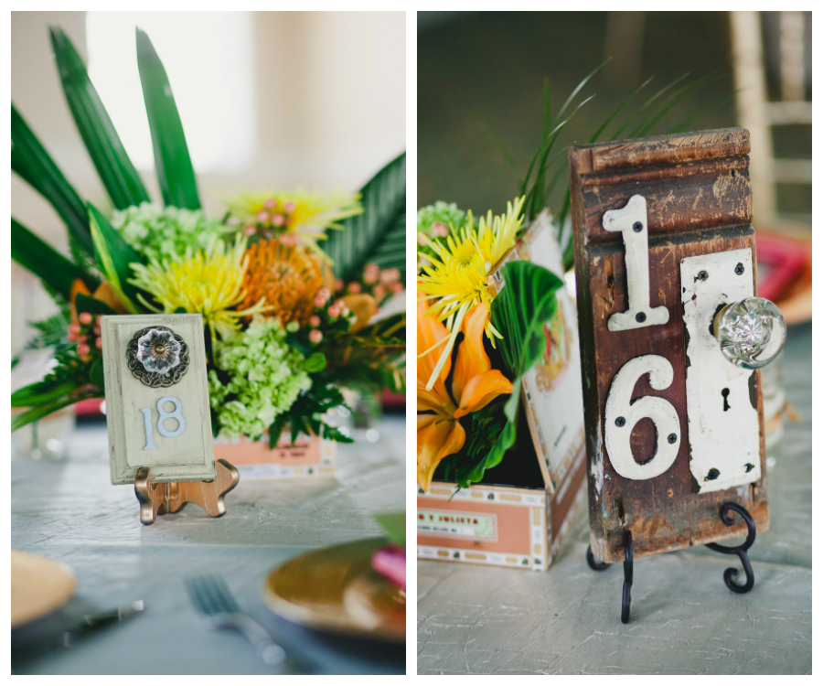 Wedding Reception Table Decor with Vintage Door Table Numbers, Cigar Boxes and Orange and Yellow Flower Centerpieces