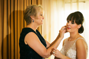Getting Ready: Bride and Mother of the Bride adjusting Veil Before Wedding Ceremony | Tampa Wedding Photographer Limelight Photography