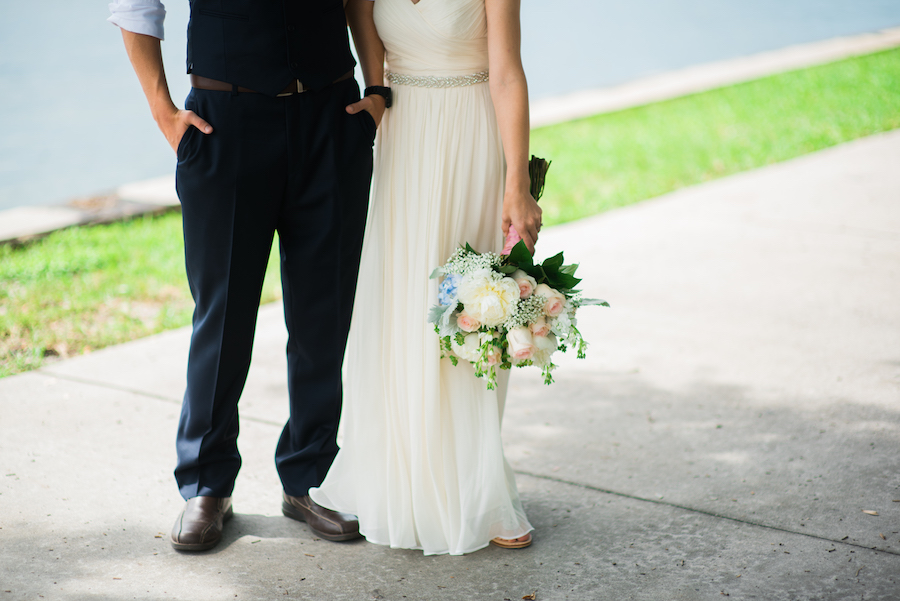 St. Petersburg Bride and Groom Wedding Portrait in Navy Blue Suit and Ivory J.Crew Wedding Dress with Ivory and Pink Floral Wedding Bouquet with Greenery | Downtown St. Pete Wedding Photographer Kera Photography