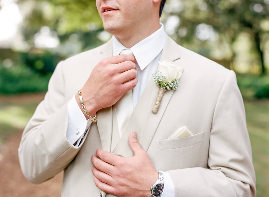 Wedding Day Portrait of Groom in Tan Khaki Suit with White Rose Boutonnière and Burlap Detail with Ivory Tie and Pocket Square
