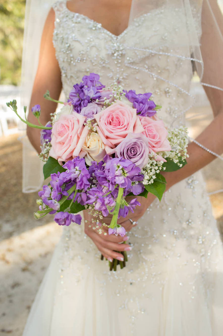 Bridal Wedding Portrait in Ivory, Beaded Lace Wedding Dress and Pink and Purple Bouquet of Flowers