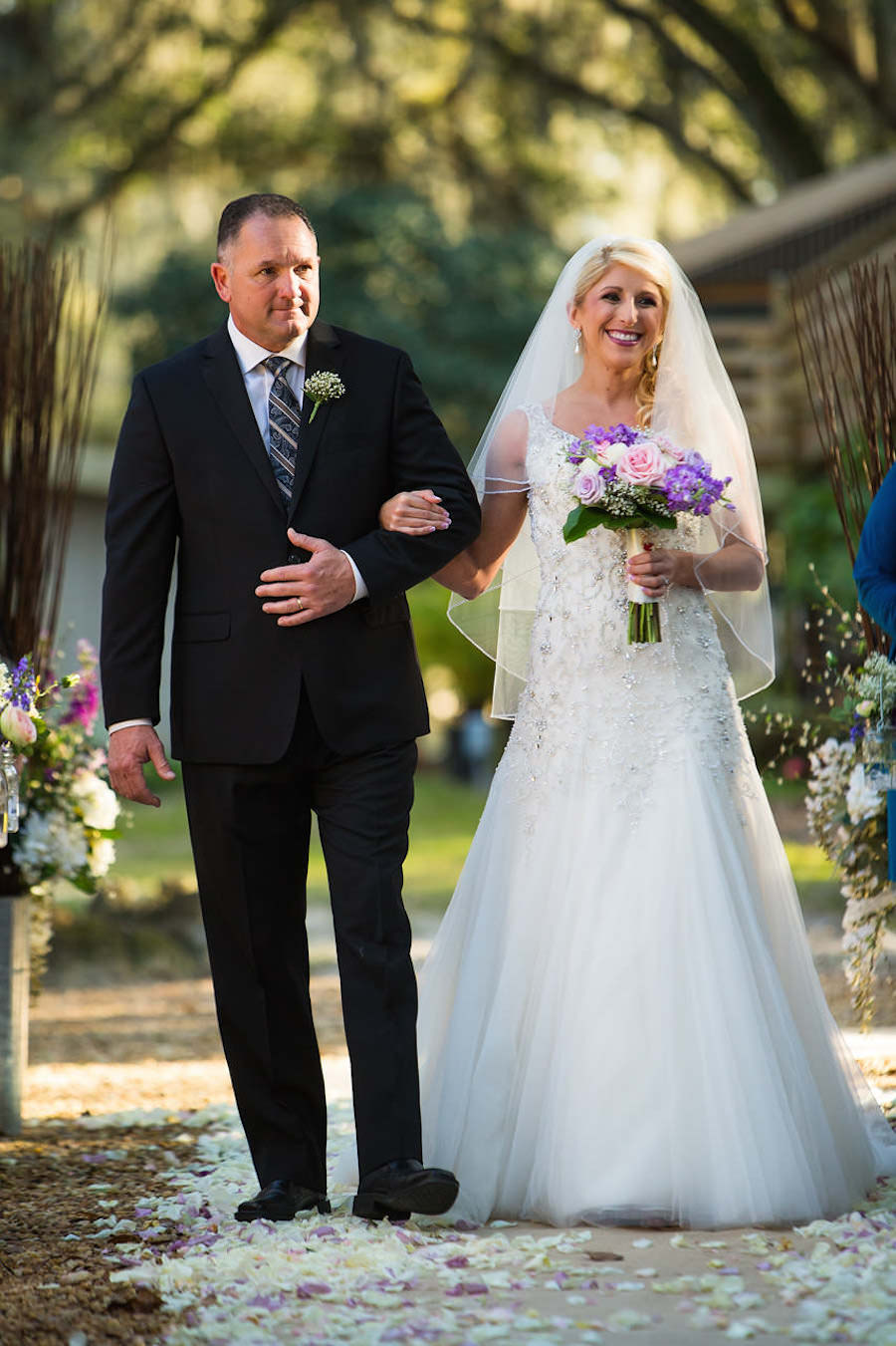 Outdoor Wedding Ceremony Bride and Dad Walking Down the Aisle with Purple and Pink Bouquet of Flowers | Plant City Wedding Photographer Jeff Mason Photography