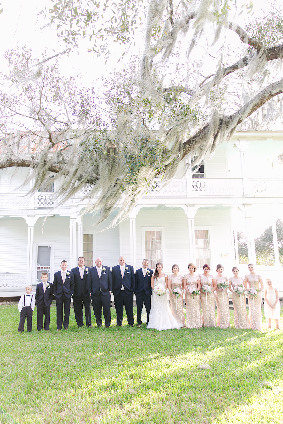 Bridal Wedding Party Outside Historic Home In Brooksville, Florida Under Spanish Moss