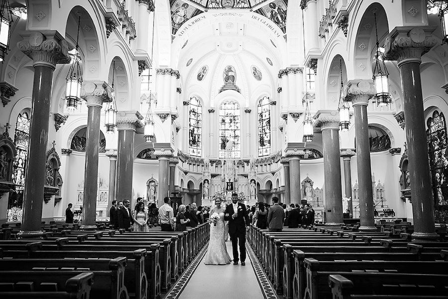 Wedding Ceremony Exit with Bride and Groom Inside Florida Cathedral Sacred Heart Catholic Church| Tampa Wedding Venue| St. Pete Wedding Photographer Limelight Photography