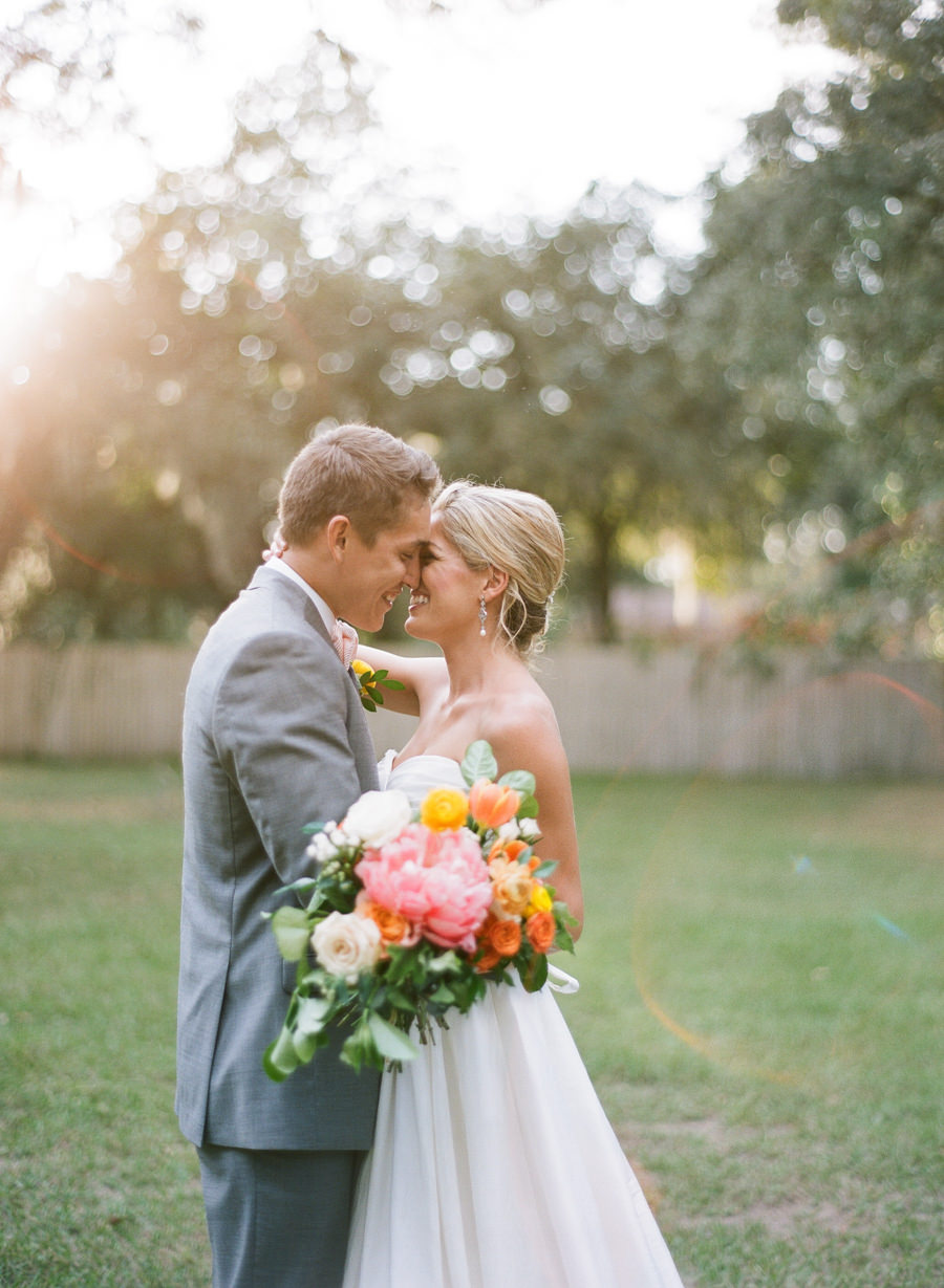 Bride with Orange, Yellow and Pink Wedding Bouquet and Groom in Grey Suit | Bridal Wedding Portrait