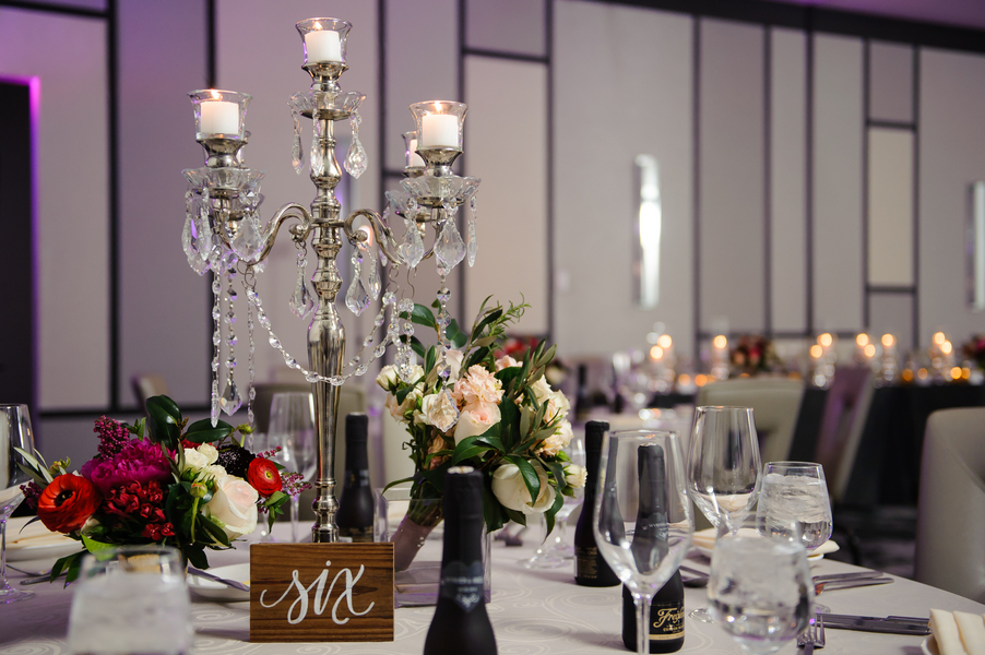 Modern and Rustic Wedding Reception with Pink, White and Red Centerpieces, Candleabra with Dripping Rhinestones and Wooden Table Number