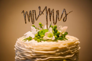 Mr and Mrs Gold Wedding Cake Topper with Green Flowers