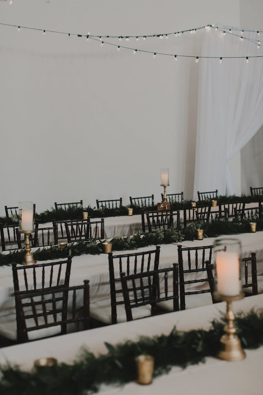 Wedding Reception Decor with Black Chiavari Chairs and Green, Garland Table Runner Centerpiece