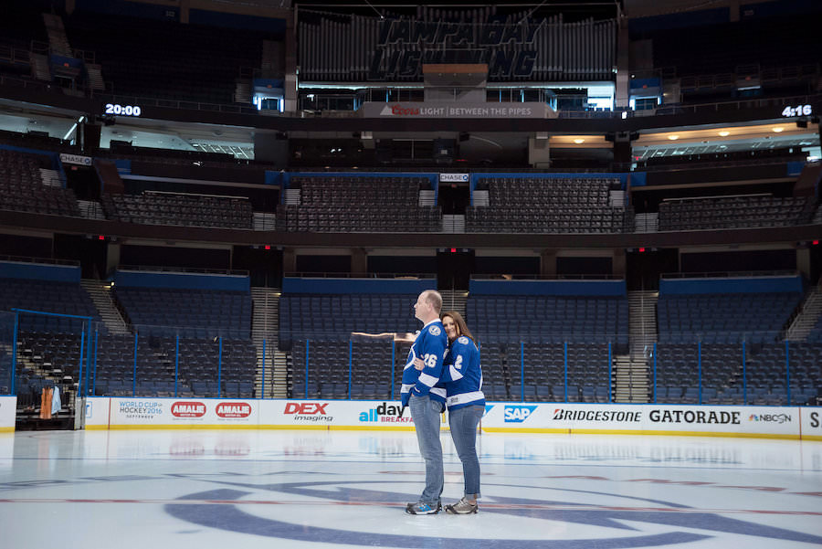 Tampa Lightning Themed Engagement Session at Amalie Arena with Hockey Jerseys on Ice | Kristen Marie Photography
