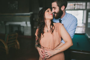 Couple Embracing in Hug| Bohemian, Old Florida Inspired Outdoor St. Pete Engagement Photography Session