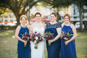 Navy Blue Mis-Matched Bridesmaid Dresses with Red and Pink Wedding Bouquet with Greenery | St. Petersburg Wedding Photography Rad Red Creative