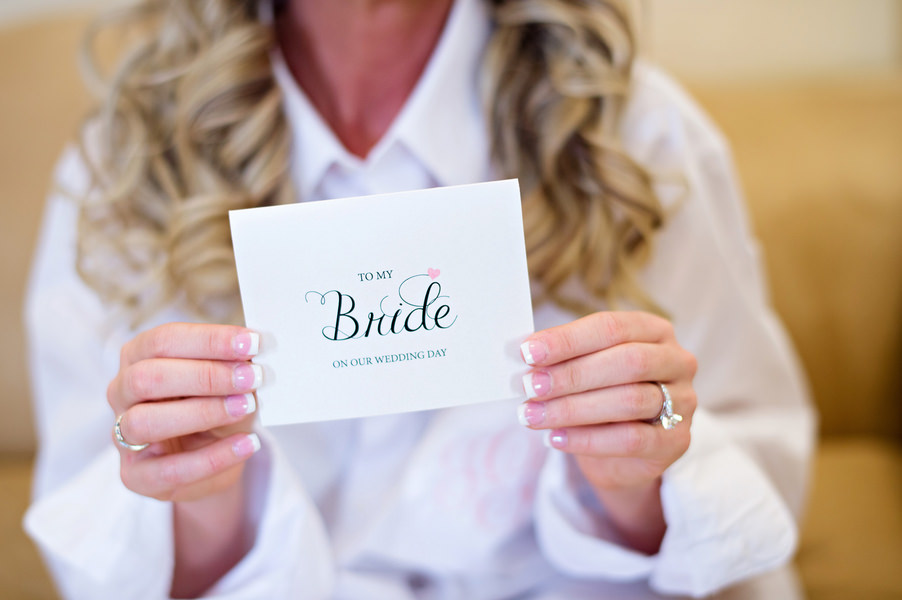 Getting Ready: Bride Reading Card from Groom on Wedding Day