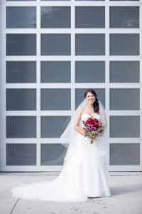 Bridal Portrait in White David's Bridal Sweetheart Strapless Wedding Dress and Red and Purple Wedding Bouquet with Greenery