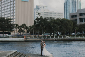 Outdoor, Downtown Tampa Waterfront Bride and Groom Wedding Portrait in Tan Suit and Ivory, Strapless JLM Couture Wedding Dress