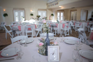 Pink Rose and Baby's Breath Wedding Centerpieces in Glass Bottle | St. Petersburg Wedding Venue St. Pete Woman's Club