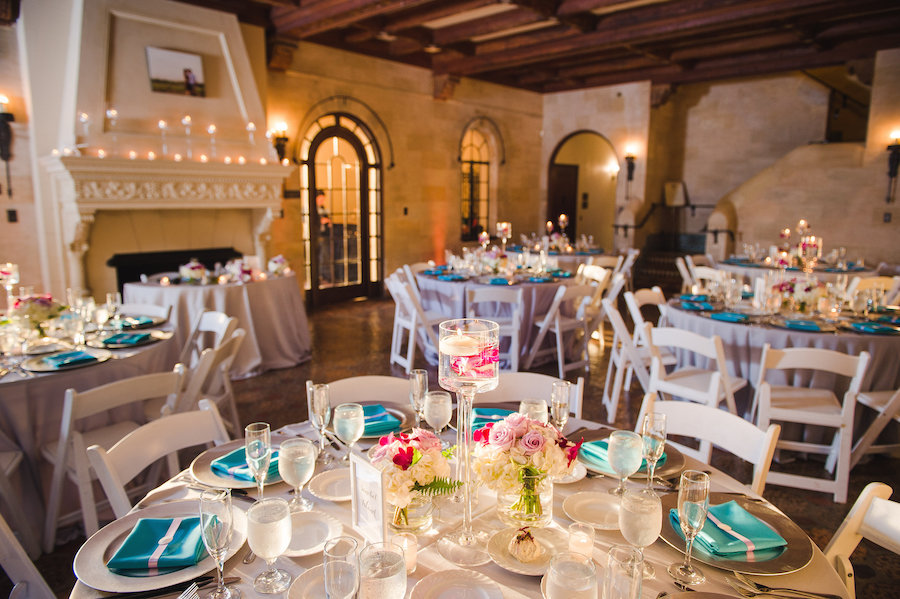 Elegant Wedding Reception Table Decor with White Folding Chairs | Tampa Wedding Planning by UNIQUE Weddings and Events