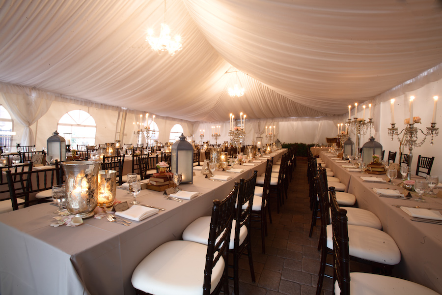 Outdoor Tented Wedding Reception with Long Feasting Tables with Elegant Decor and Lantern Centerpieces with Black Chiavari Chairs| Tampa Wedding Planning by UNIQUE Weddings and Events