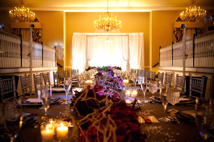 Wedding Reception Long Feasting Table with Branch Centerpieces and Chandeliers | Tampa Wedding Planning by UNIQUE Weddings and Events