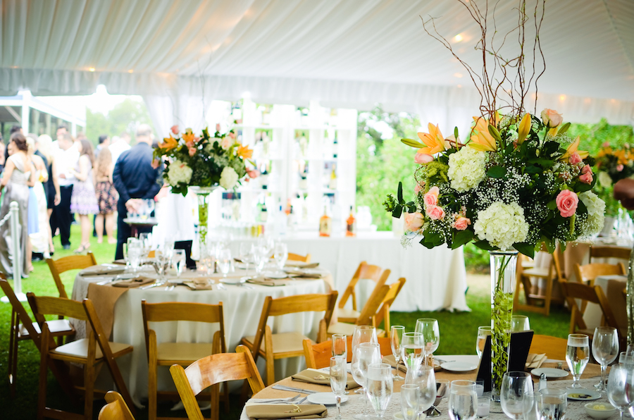 Outdoor Tented Garden Wedding Reception with Wooden Folding Chairs and Tall Centerpieces| Tampa Wedding Planning by UNIQUE Weddings and Events