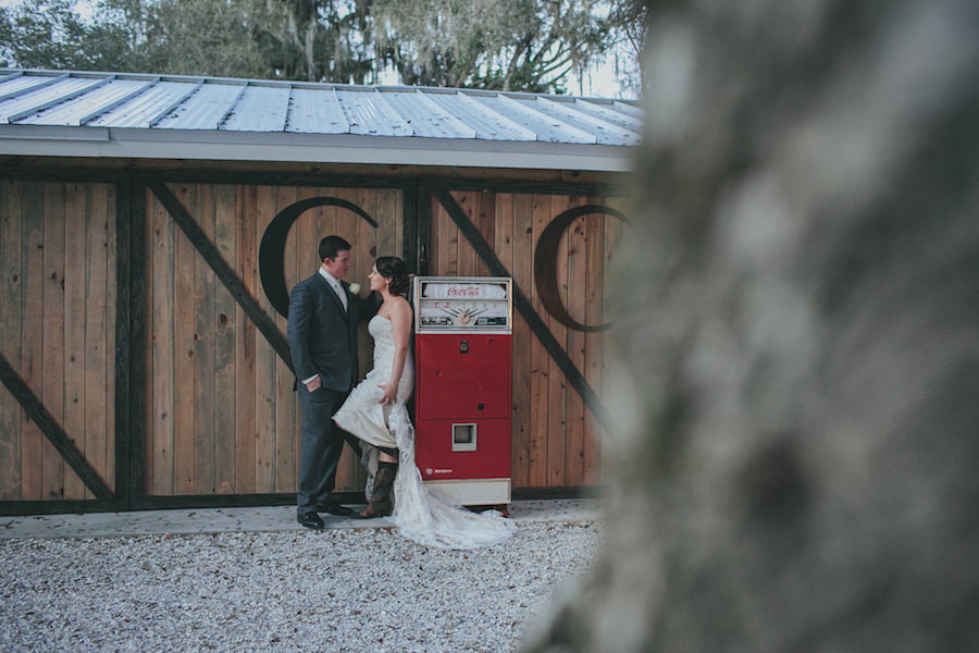 Rustic, Outdoor, Bride and Groom Sarasota Wedding Portrait with Vintage Coca Cola Machine