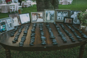 Outdoor, Wedding Reception Guest Seating Place Numbers on Rocks , Surrounded with Vintage, Family Photographs