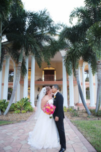 Bride and Groom Wedding Portrait with Fuchsia and Orange Bouquet Outside Private Residence with Palm Trees | St Petersburg Wedding Planner Exquisite Events