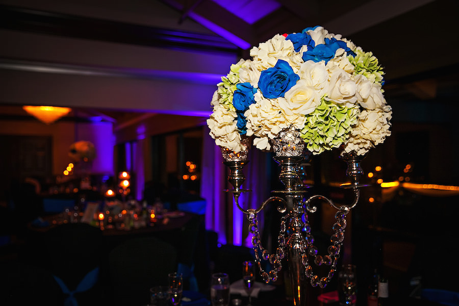 Tall Wedding Reception Centerpiece with Blue Roses, Light Green and Ivory Hydrangeas on Pewter Candelabras | Countryside Country Club Wedding Venue Clearwater Florida | Limelight Photography