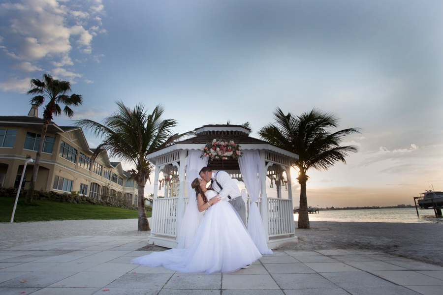 Outdoor, Sunset Waterfront Bride and Groom Wedding Portrait | Allure Bridal | Isla Del Sol Yacht and Country Club St. Petersburg FL Wedding Venue
