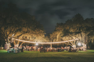Outdoor, Rustic Nighttime Sarasota Wedding Reception with Tree Strung Market Lights | Sarasota Wedding Venue Southern Oaks Reception with Tree Strung Lights