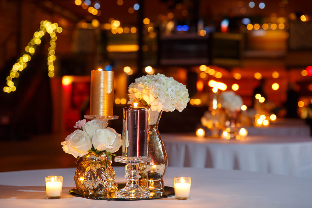 Candles and Votives with White and Ivory Rose and Hydrangea Wedding Centerpieces on Mirrored Stands | New Year's Eve Wedding Reception Decor