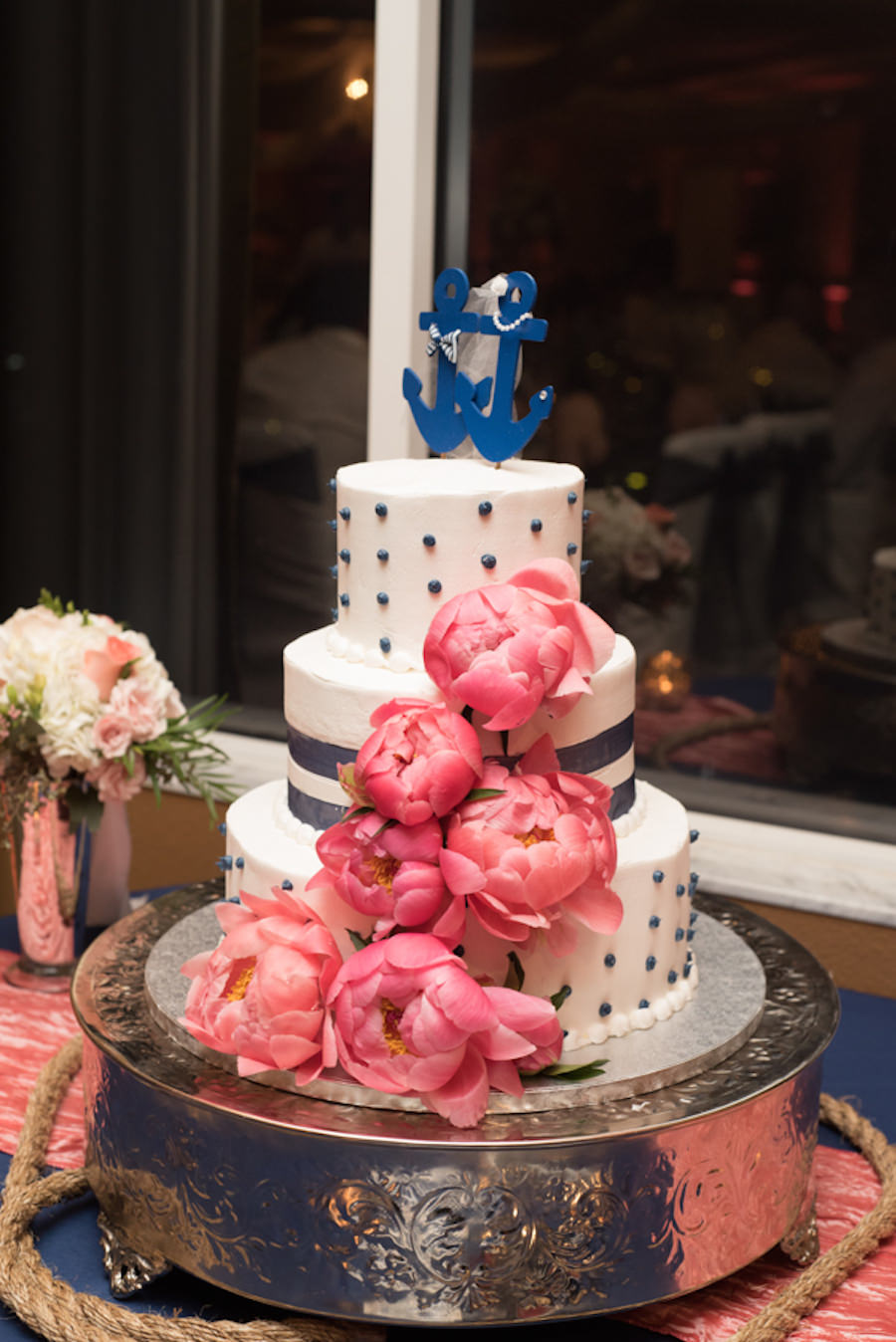 Nautical Themed Three Tier Round Wedding Cake with Navy Polka Dots and Coral Pink Peonies and Anchor Cake Topper | St Petersburg Wedding Florist Iza’s Flowers