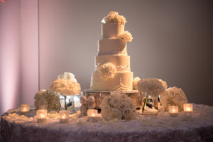 4 Tiered, Round, White Wedding Cake with White Floral Accents