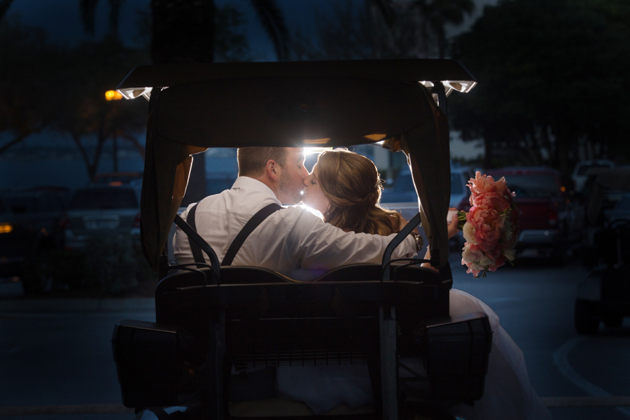 Bride and Groom Wedding Portrait in Golf Cart with Coral Floral Bouquet | Iza’s Flowers Wedding Florist St. Petersburg FL