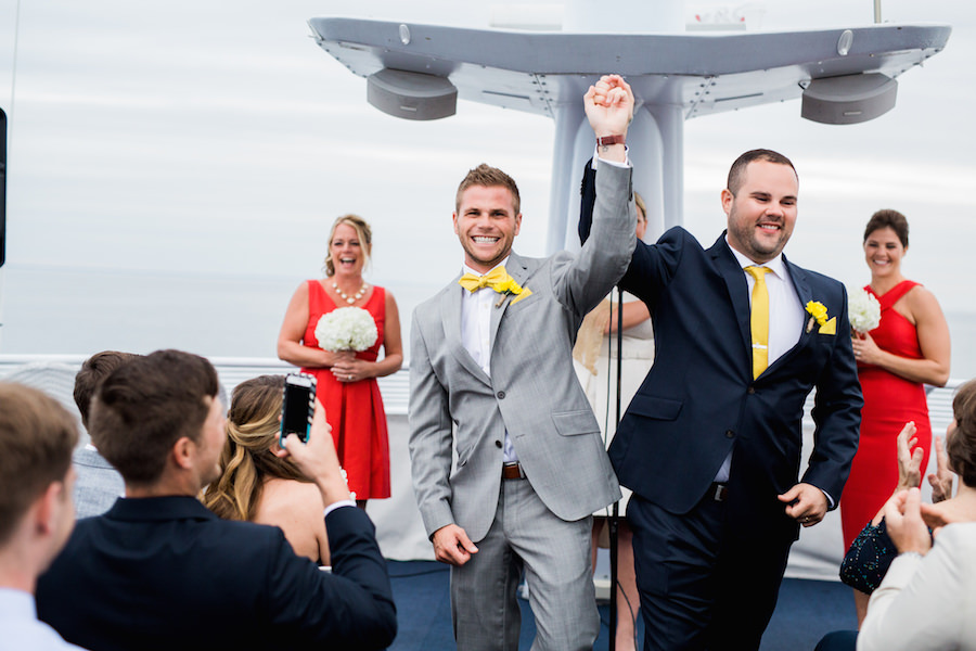 St. Petersburg Same Sex Wedding Portrait in Navy Blue and Gray Suits With Yellow Boutonnieres | The Yacht Starship Wedding Venue
