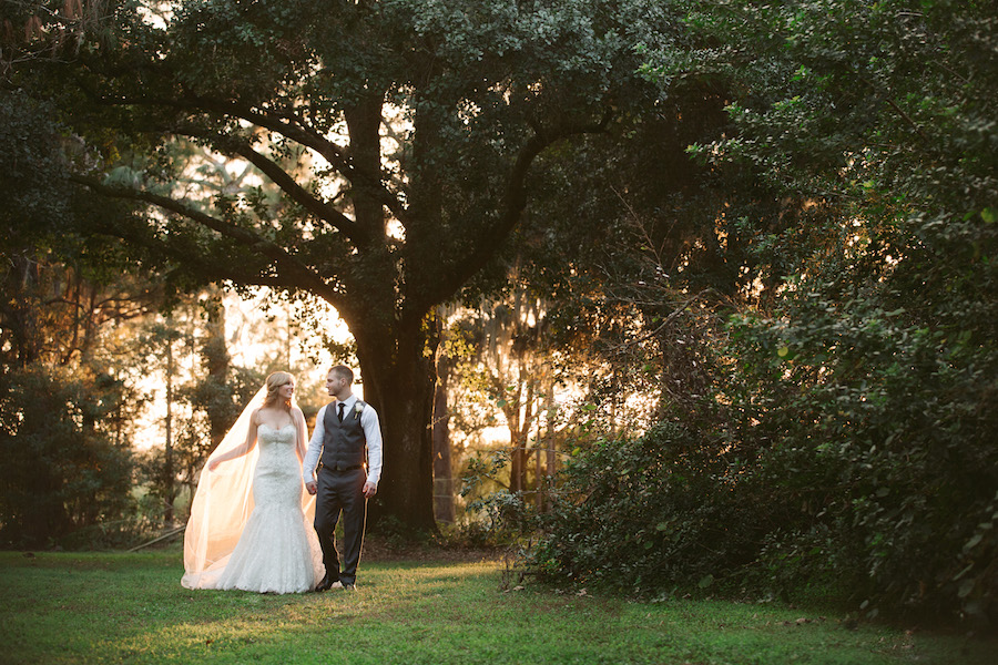 Bride and Groom Outdoor Tampa Bay Wedding Portrait in Woods | Allure Couture Strapless Lace Sweetheart Trumpet Wedding Gown