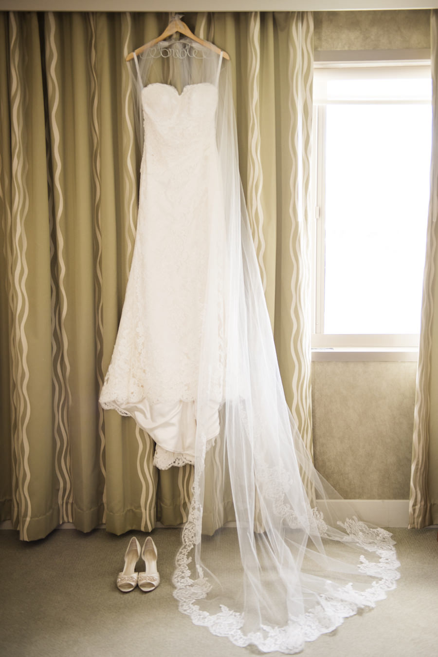 White, Strapless Lace Wedding Gown, Lace Trim Veil, and White Wedding Shoes for Tampa Wedding