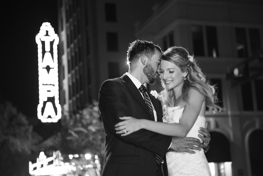 Bride and Groom, Outdoor, Nighttime Bridal and Groom Wedding Portrait in Downtown Tampa with Tampa Theatre Lighted Sign