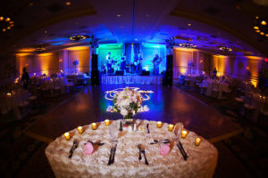 Wedding Reception Decor with Projection Floor GOBO Monogram, and Blue Uplighting and Sweetheart Table | Tampa Wedding Lighting Gabro Event Services | Linen Rentals Over the Top Linens | Wedding Planner Parties a la Carte