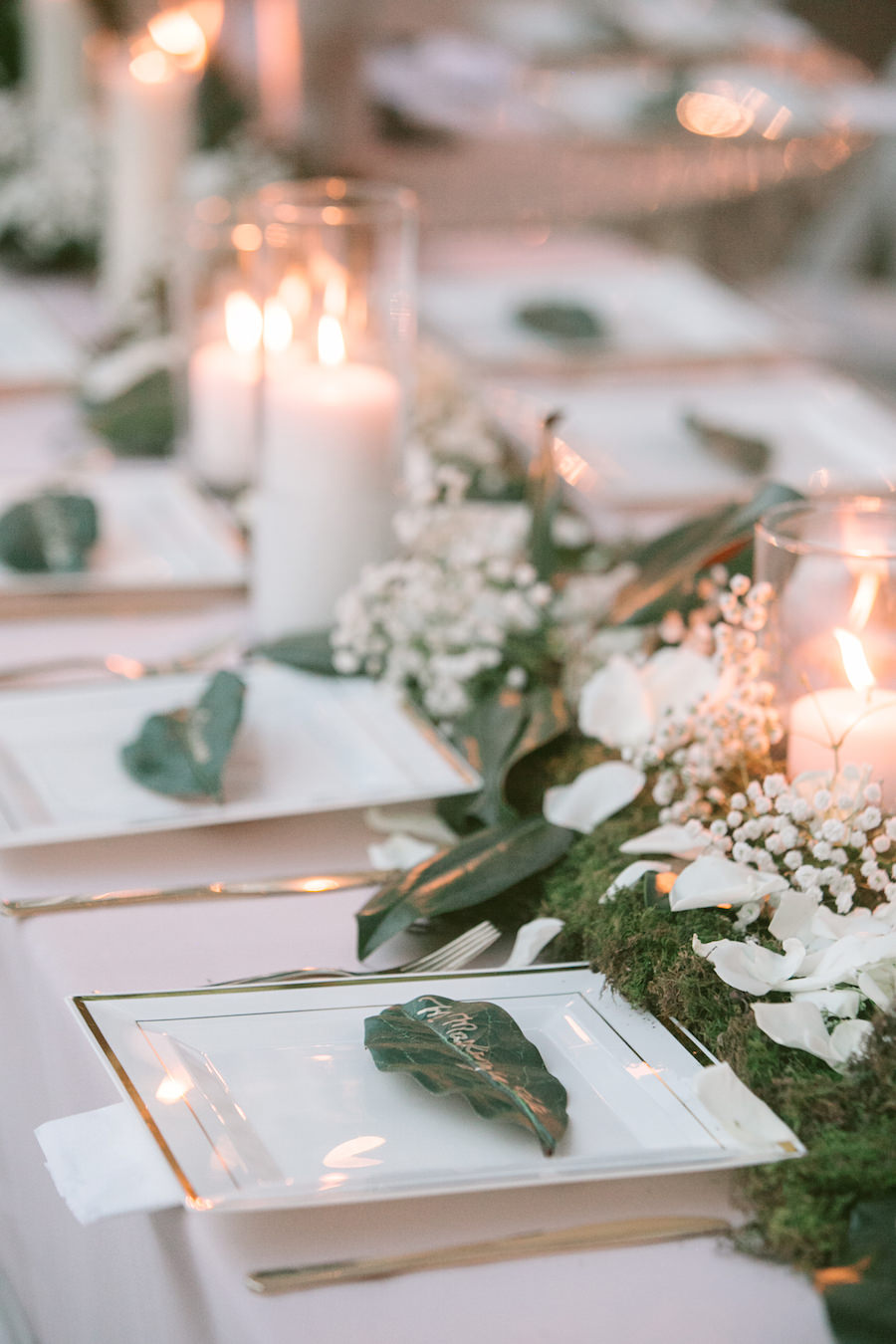Rustic Wedding Table Setting with White Candles, Ivory Rose Petals, Baby’s Breath and Greenery | Tampa Bay Wedding Floral Designer Northside Florist