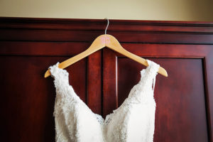 White, Ivory Romona Keveza Lace Wedding Gown with Straps on Monogram Wedding Hanger | Tampa Wedding Dress Shop Isabel O'Neil Bridal