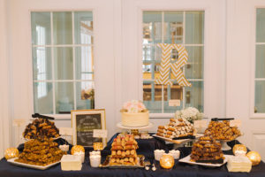 Wedding Reception Dessert Table with Cannolis and Single Tier Cream Wedding Cake
