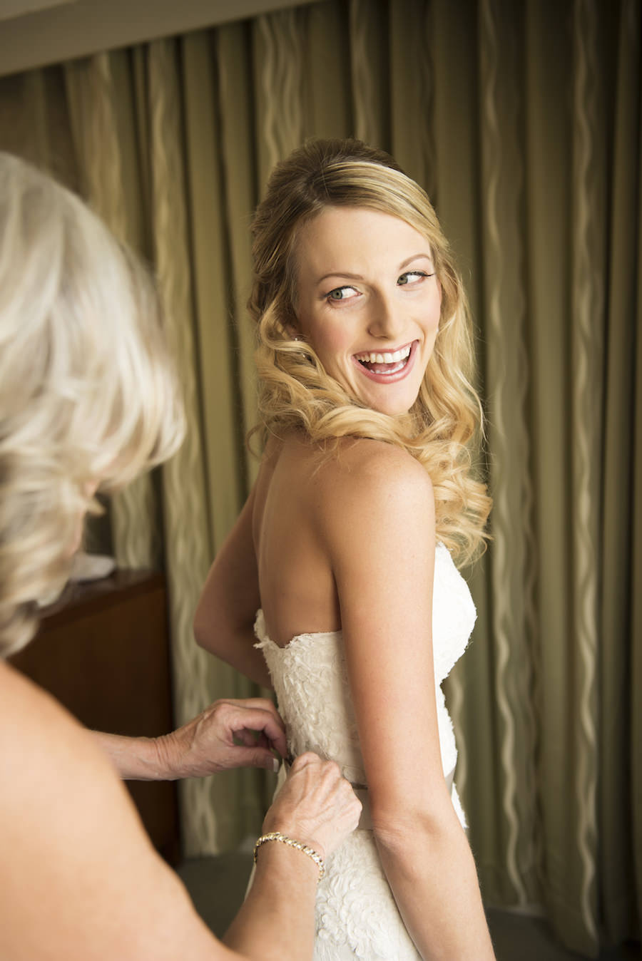 Bride Getting Dressed/Ready in White, Lace, Strapless Wedding Dress