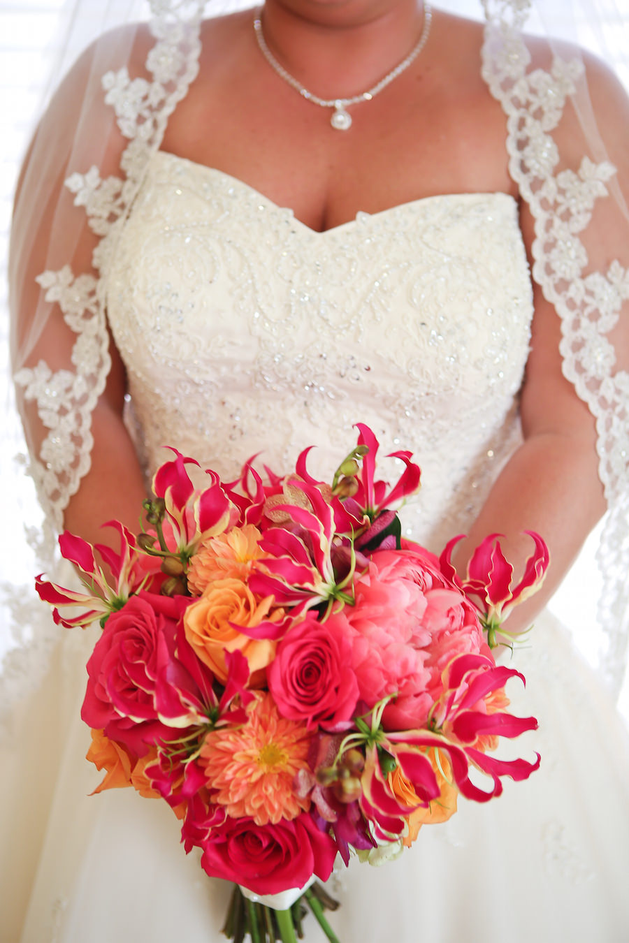 Bridal Wedding Portrait in Ivory Stella York Wedding Dress and Bright Pink and Orange Bouquet with Roses, Peonies and Gerbera Daisies | St Petersburg Wedding Planner Exquisite Events