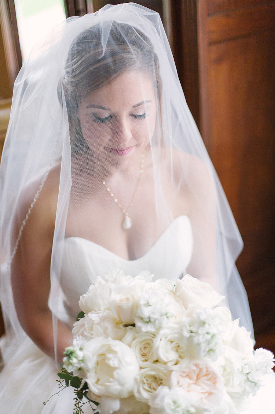 Traditional Bridal Wedding Portrait in Strapless, White Wedding Dress, Veil, and White Floral Bridal Bouquet | Bradenton Wedding Florist Iza's Flowers