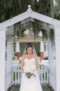 Outdoor, Bridal Wedding Portrait in Strapless, White Wedding Dress and White Floral Bridal Bouquet | Bradenton Wedding Florist Iza's Flowers