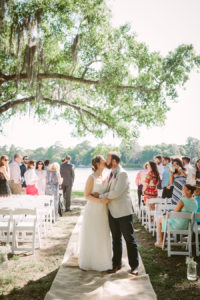 Rustic, Wedding Ceremony | Bride and Groom Kissing at Aisle |Tampa Bay Wedding Venue Old McMicky's Farm The Barn at Crescent Lake