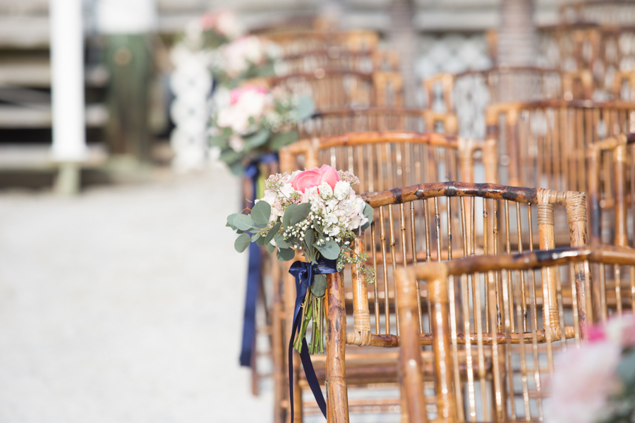Coral and White Roses with Greenery and Navy Ribbon Aisle Flowers with Folding Bamboo Chairs | Nautical Navy and Coral Wedding Ceremony Décor Ideas | St Petersburg FL Wedding Florist Iza’s Flowers