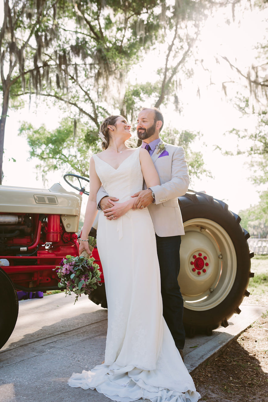 Outdoor, Rustic Bride and Groom Wedding Portrait with Red Tractor