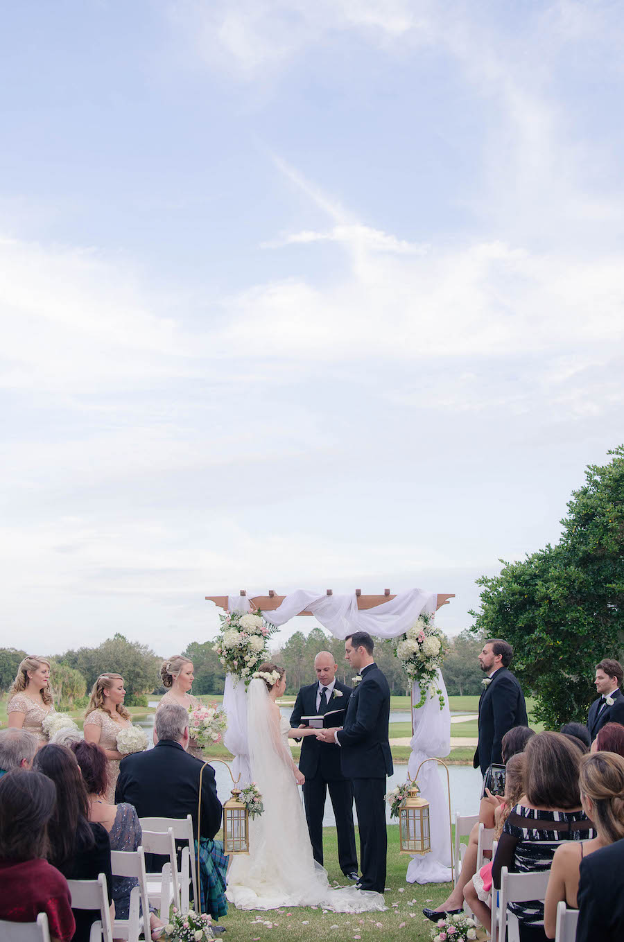 Bride and Groom Outdoor Wedding Ceremony with Arch and Draping | Tampa Wedding Floral Designer Northside Florist | Tampa Country Club Wedding Venue Hunter's Green Country Club